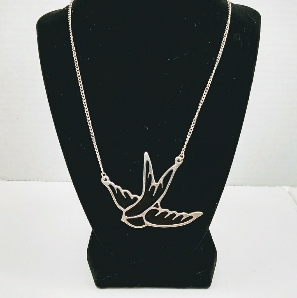 Silver tone bird in flight necklace